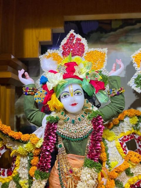 Deities adorned with flowers for Pushpa Abhishek at ISKCON Satara — photo 1 of 10